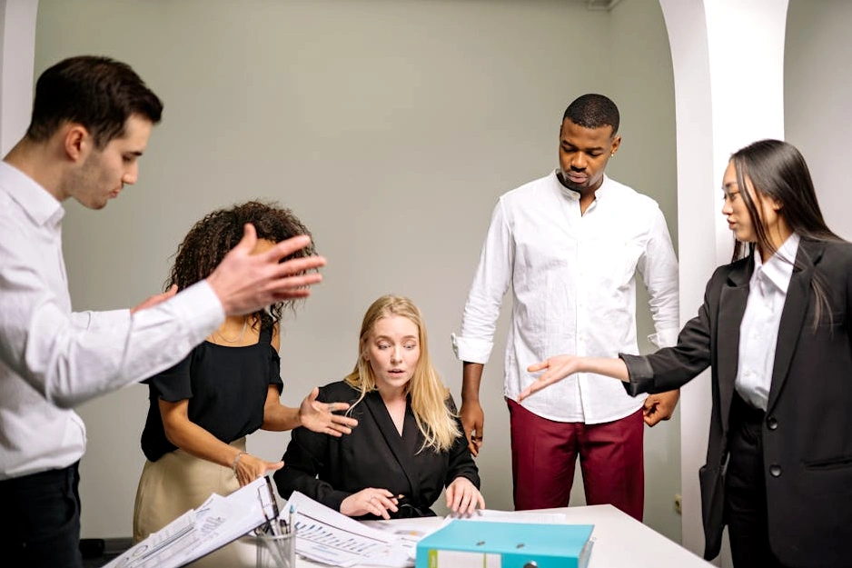 A team of professionals collaborating in a modern, minimalist office environment.